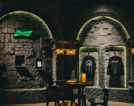 Campaign apparel displayed in the stone exhibition environment