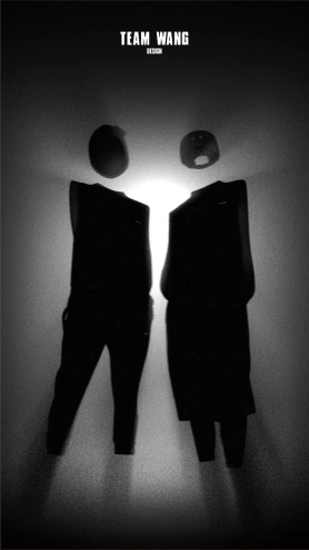 Black garments and suspended headwear silhouetted against a studio light