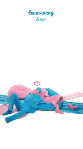 Blue and pink figures reclining together across the studio floor